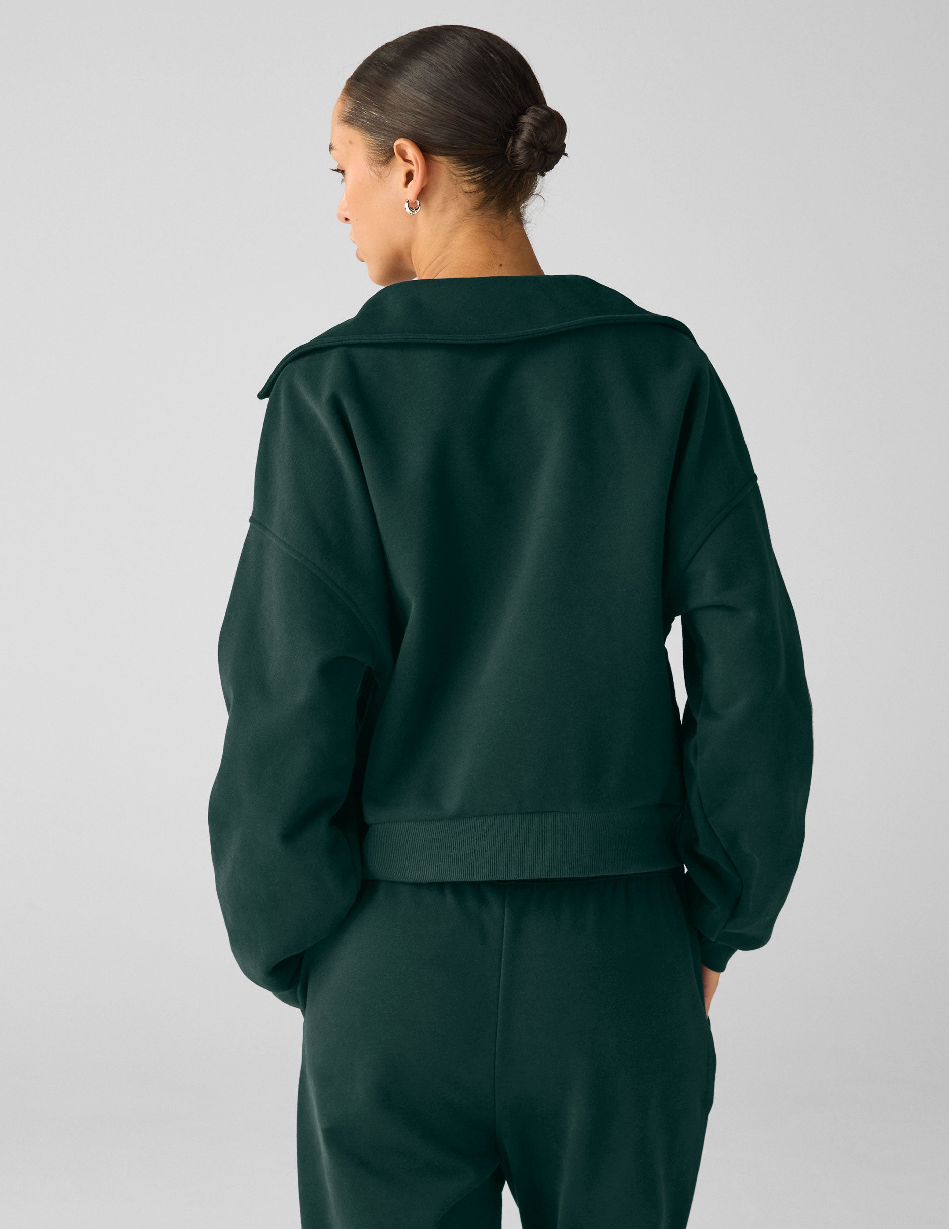 green pullover sweater with a collar and kangaroo pocket. 