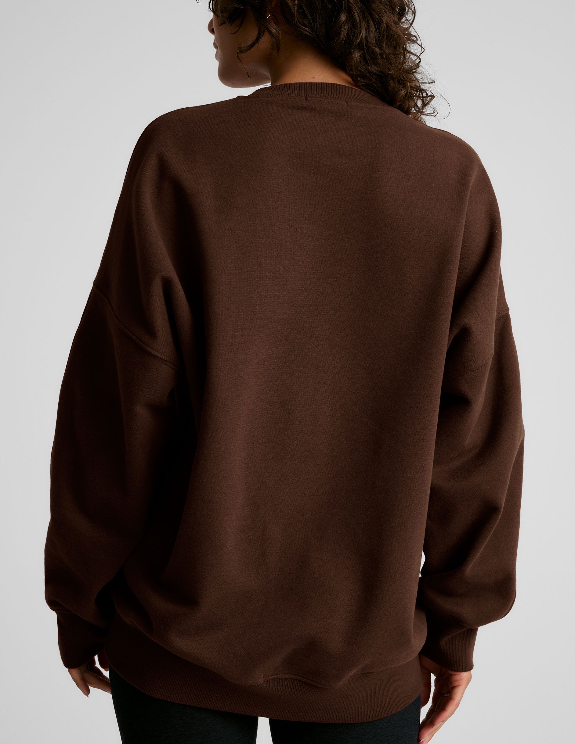 brown crew neck sweatshirt.