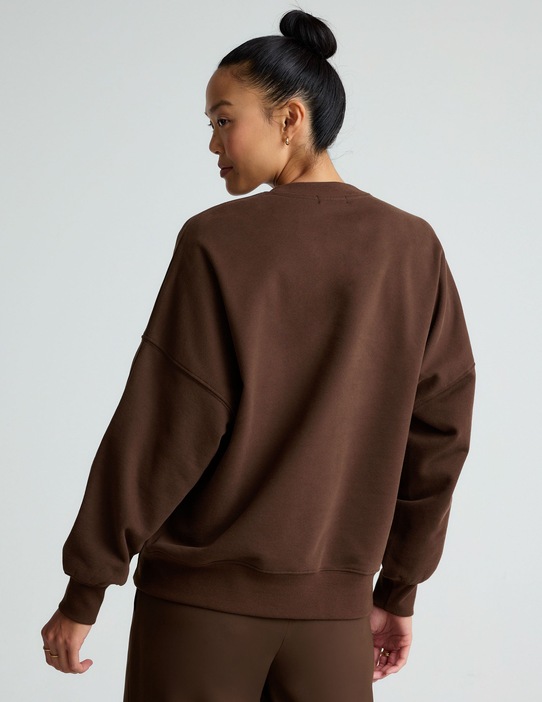 brown crew neck sweatshirt.