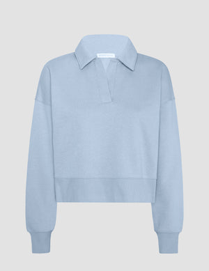 blue cropped long sleeve pullover with a v-neck collared neckline. 