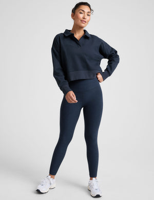 blue cropped long sleeve pullover with a v-neck collared neckline. 