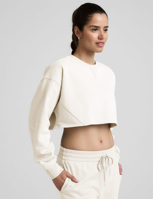 white cropped crew neck loose fitting sweatshirt. 