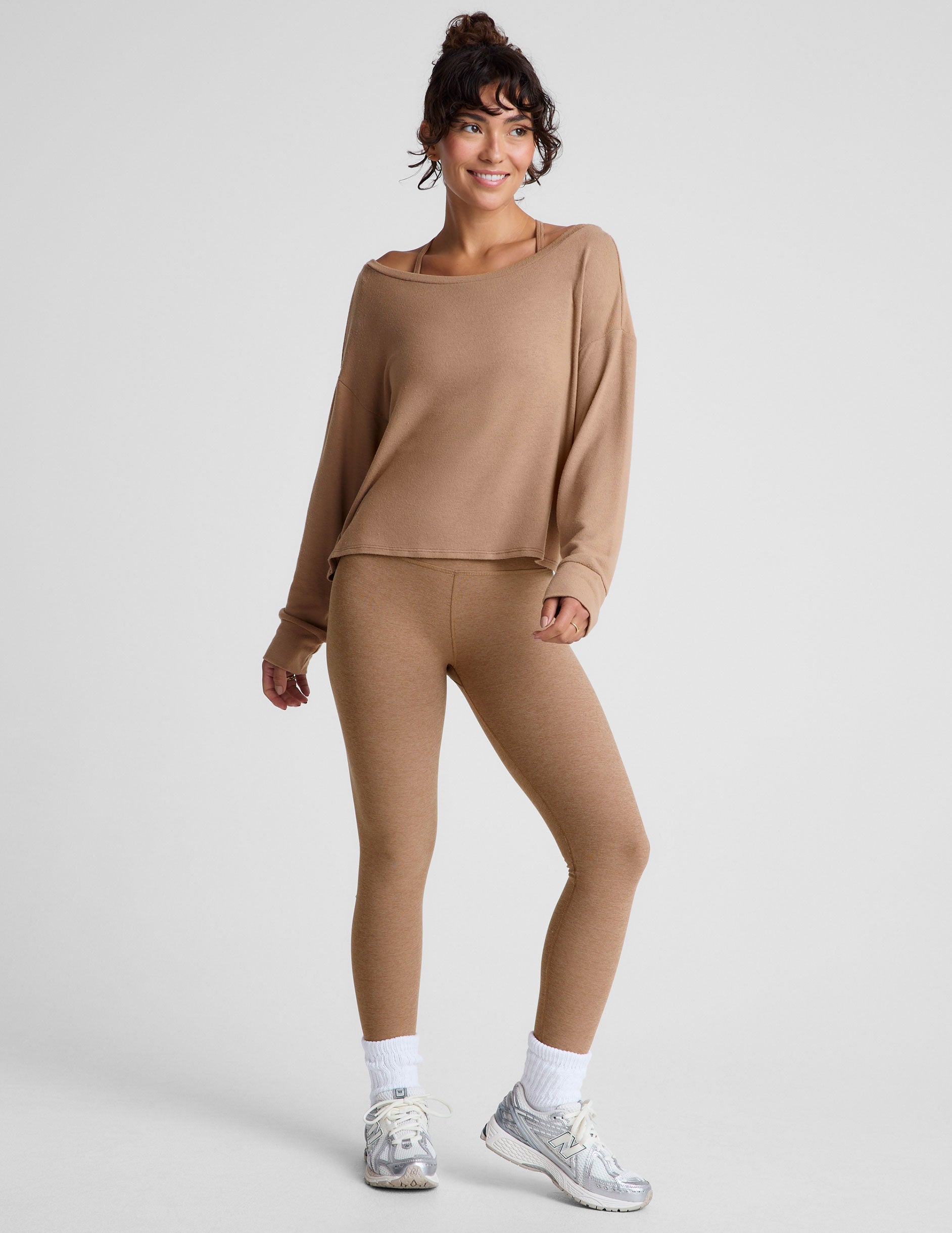 brown classic length long sleeve sweater with a wide off-the-shoulder neckline. 