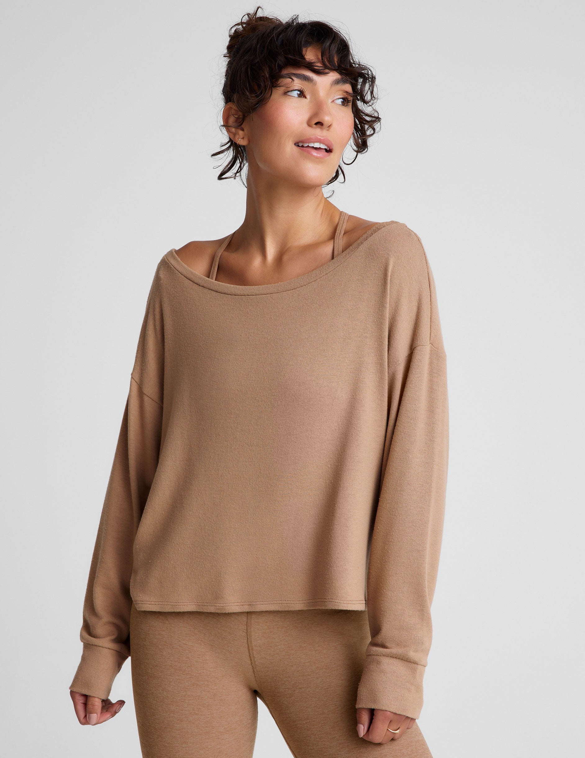 brown classic length long sleeve sweater with a wide off-the-shoulder neckline. 