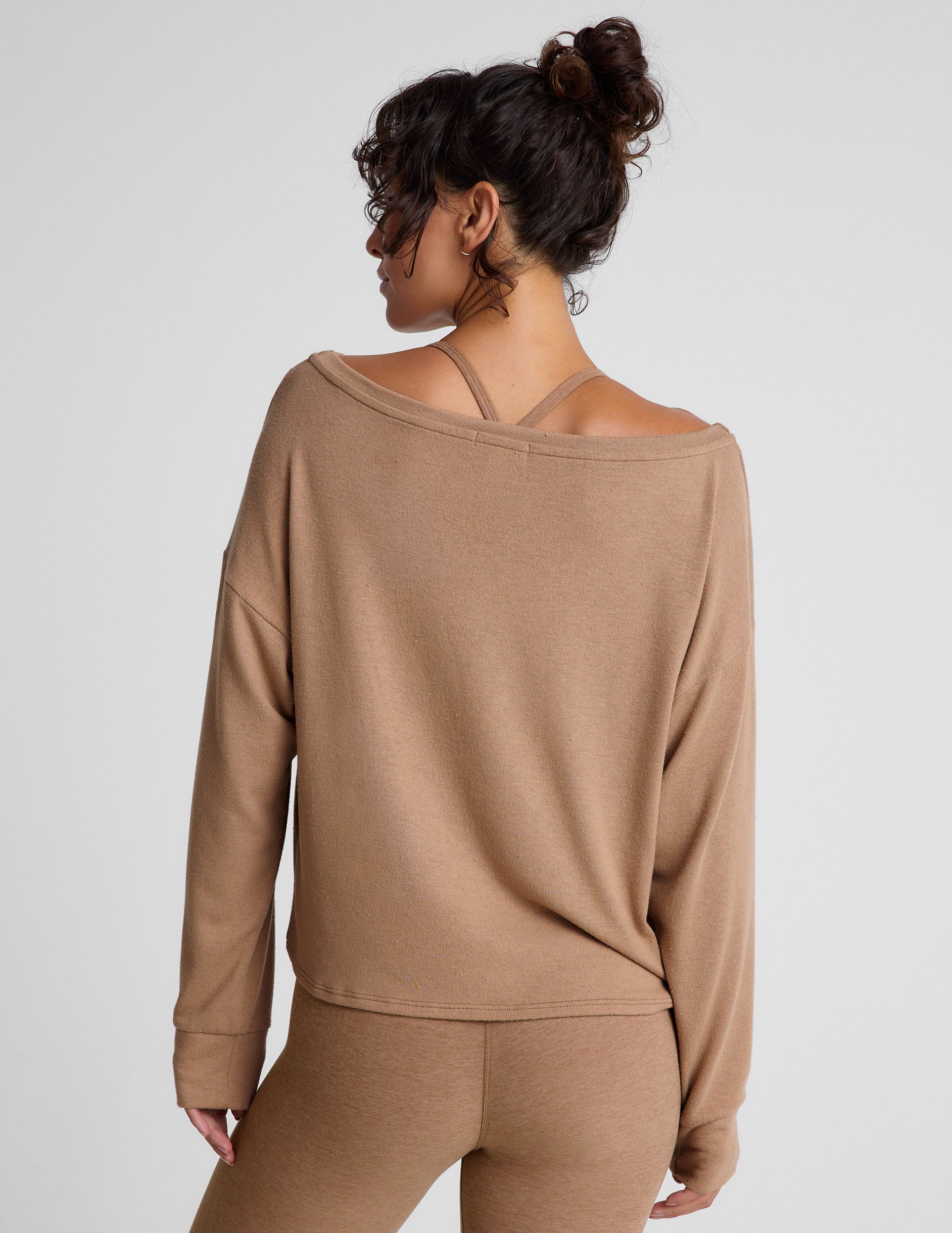 brown classic length long sleeve sweater with a wide off-the-shoulder neckline. 