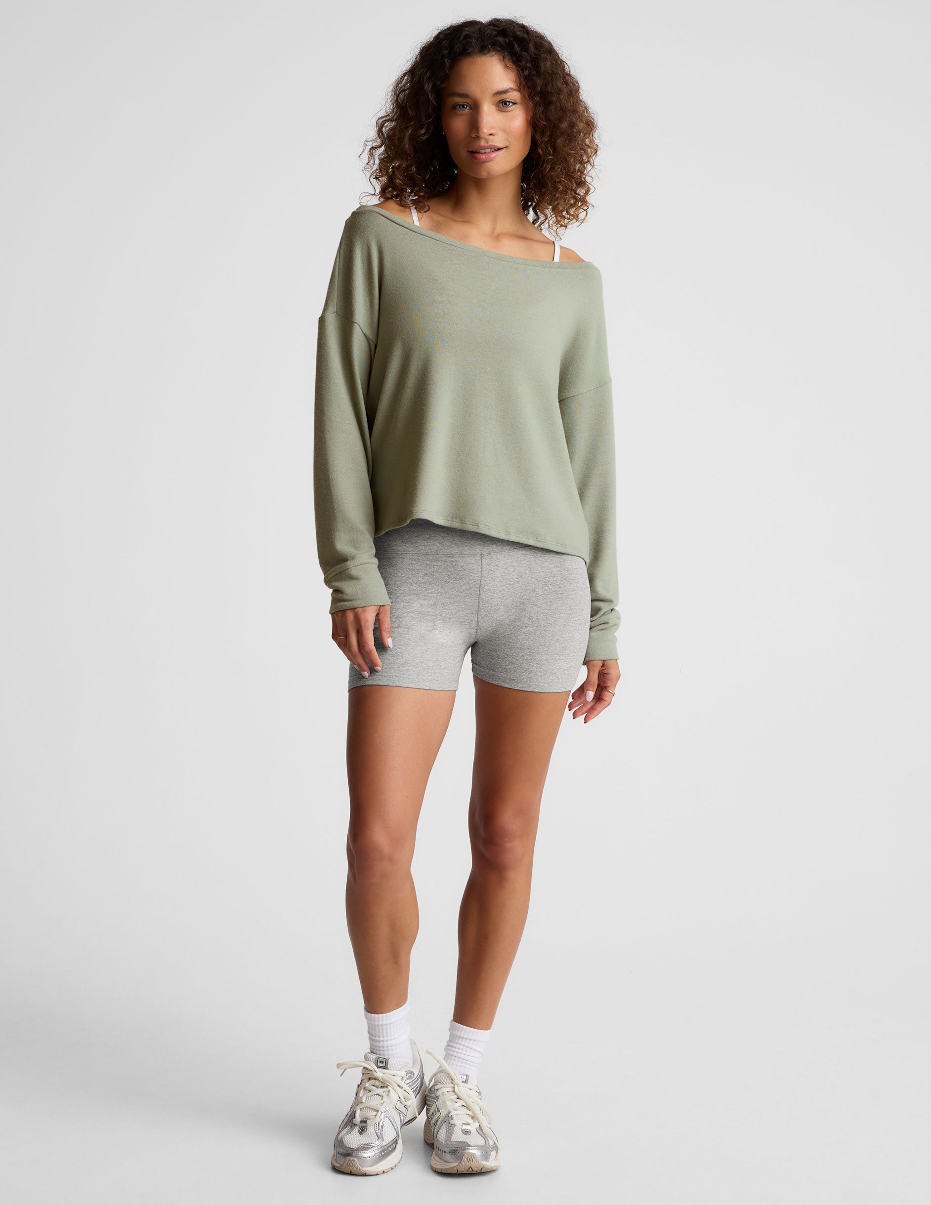 green classic length long sleeve sweater with a wide off-the-shoulder neckline. 