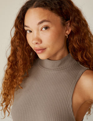 brown mock neck ribbed midi dress with a front side slit. 