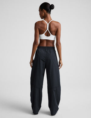 Back view of the Limitless Mid-Rise Barrel Leg Pant in dark gray, showing its gathered waist and wide barrel-leg fit.