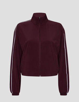 red zip-up jacket with white piping and pockets. 