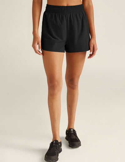 black athletic shorts with built-in shorts underneath. 