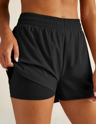 black athletic shorts with built-in shorts underneath. 