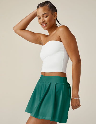 green pleated mini skirt with interior shorts with pockets
