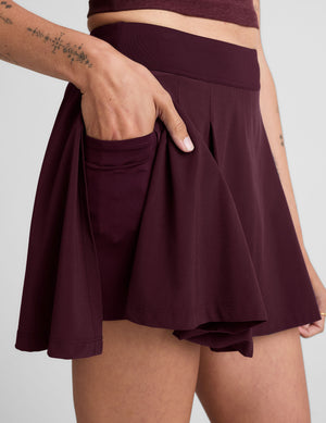 red mini skirt with built-in shorts with pockets. 