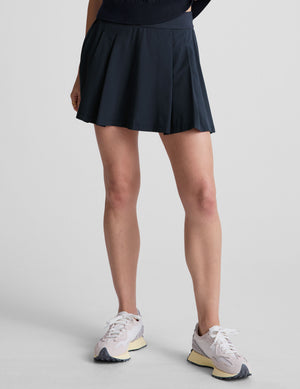 blue mini pleated skirt with interior shorts with pockets. 