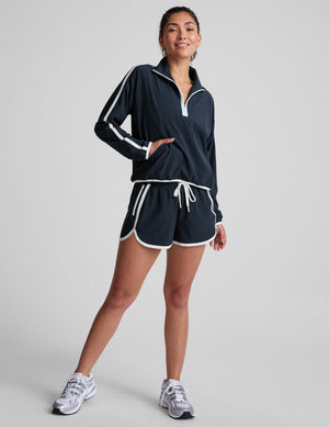 blue pullover with a half zip front​ and front kangaroo pocket​. 