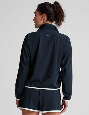 blue pullover with a half zip front​ and front kangaroo pocket​. 
