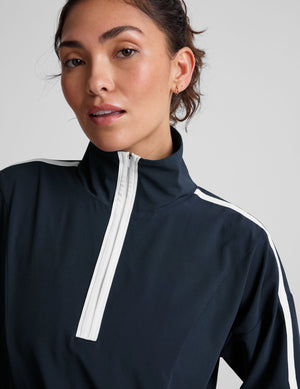 blue pullover with a half zip front​ and front kangaroo pocket​. 