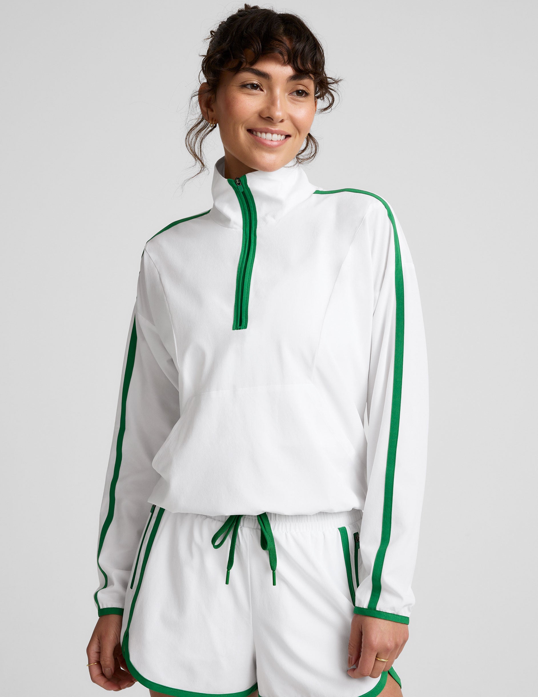 white and green half zip jacket