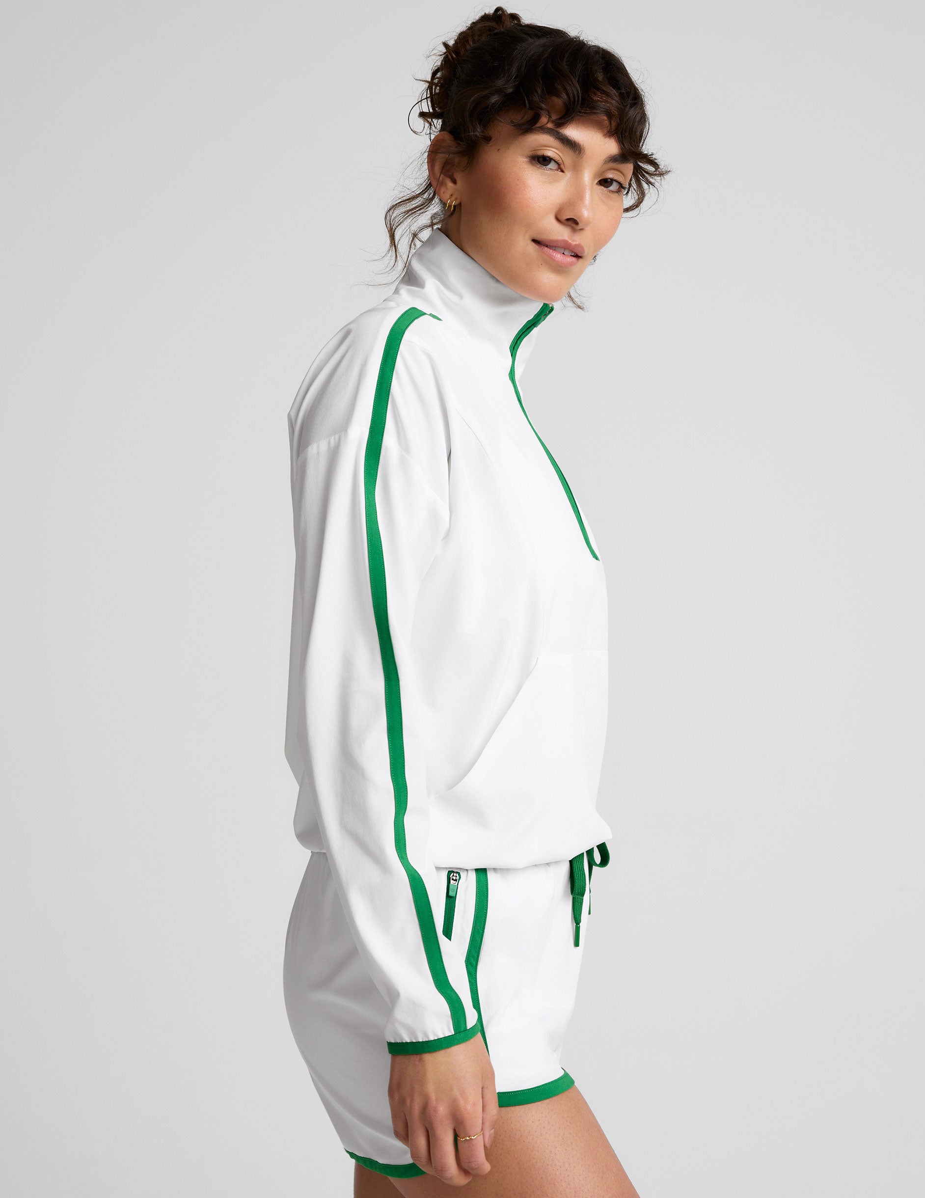 white and green half zip jacket