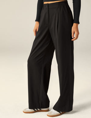 Black Status Wide Leg Trousers with a pleated front, elasticated waistband, and a relaxed, flowing straight-leg fit.