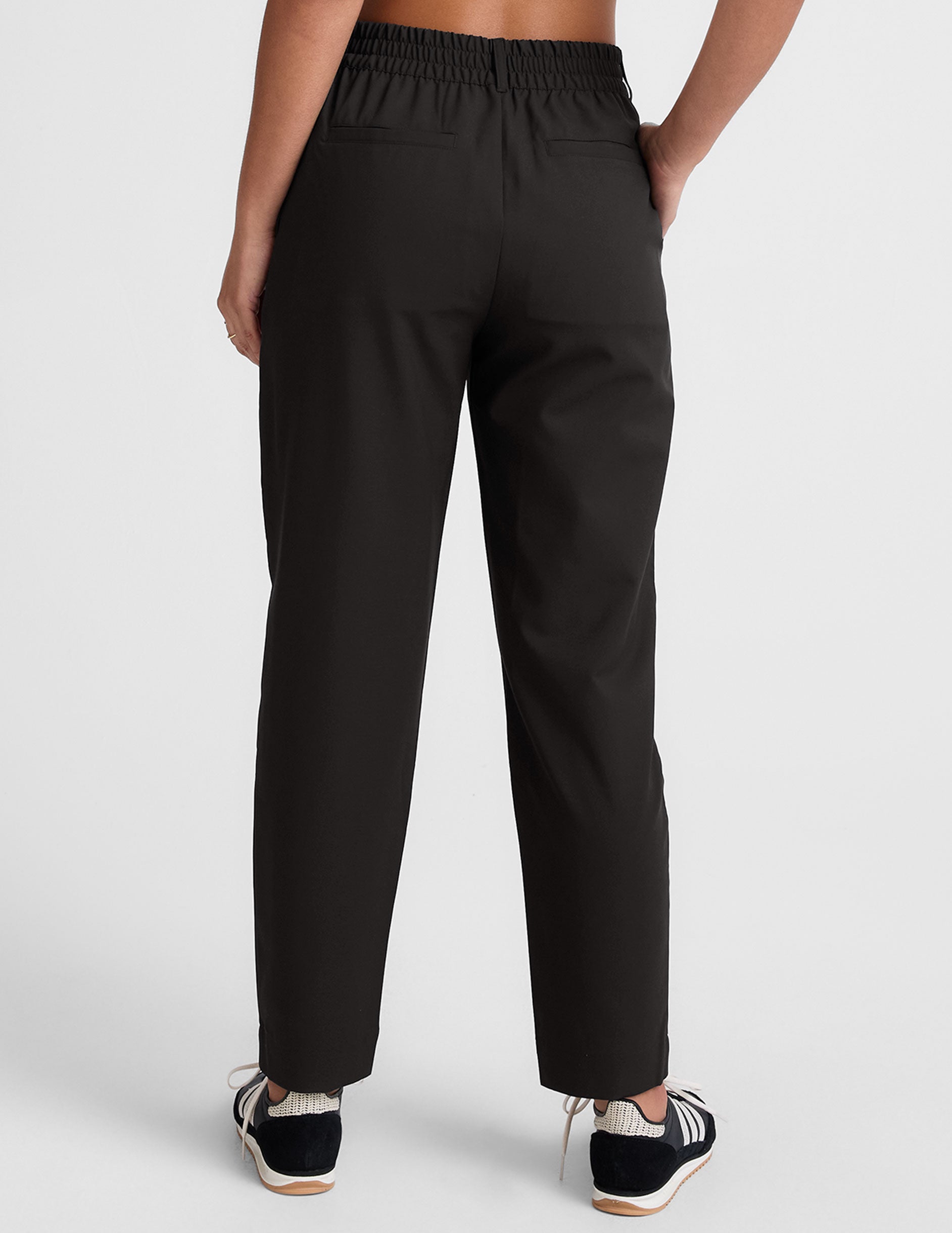 black trouser style pant with a tapered ankle and pockets. 