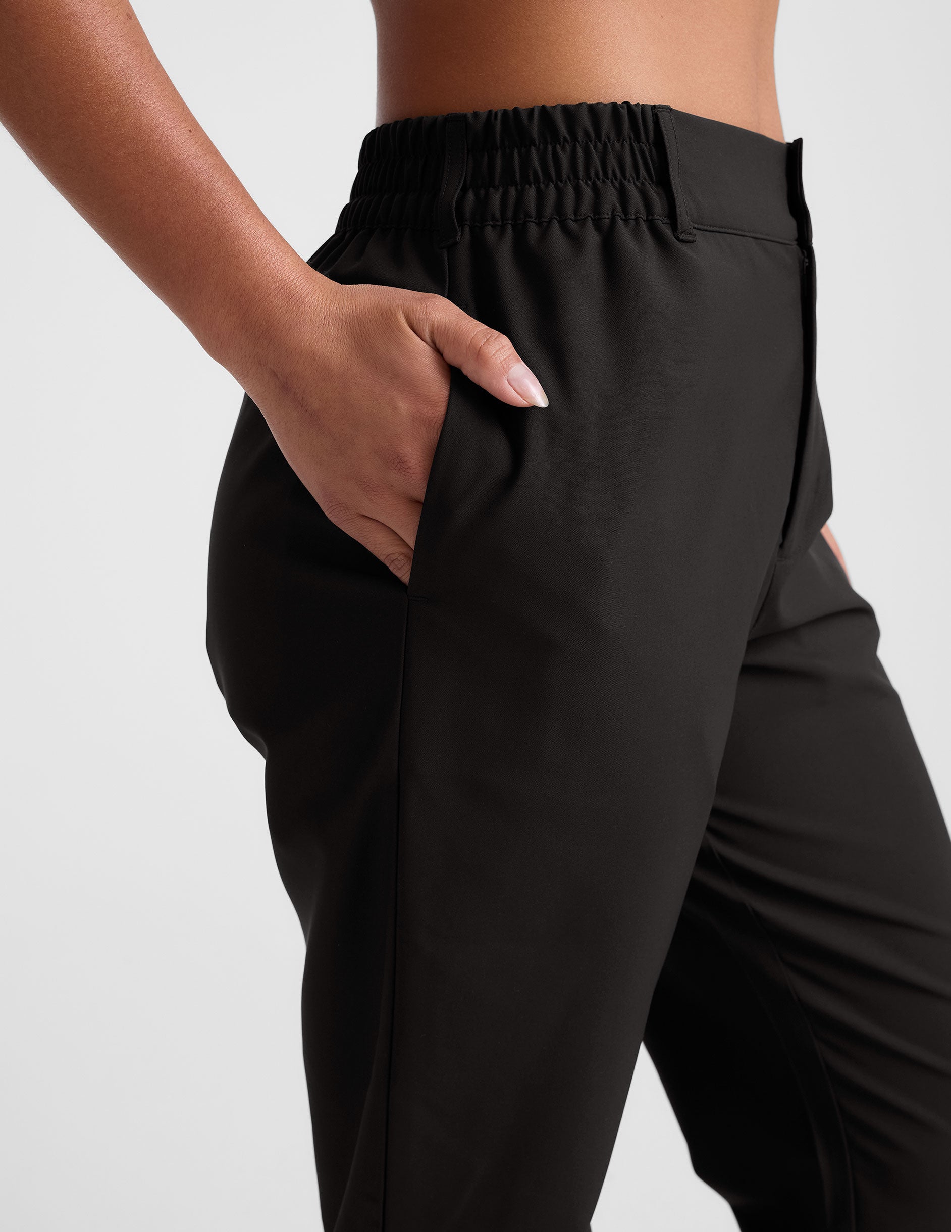 black trouser style pant with a tapered ankle and pockets. 