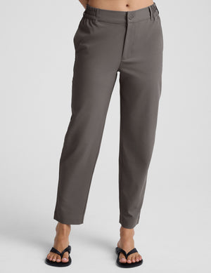 gray trouser style pant with a tapered ankle and pockets. 