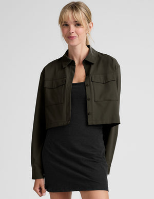 green cropped jacket with front chest cargo pockets and a collar at neckline. 