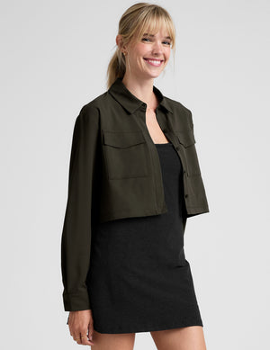 green cropped jacket with front chest cargo pockets and a collar at neckline. 