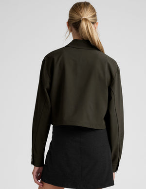 green cropped jacket with front chest cargo pockets and a collar at neckline. 
