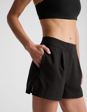 black high-waisted trouser shorts. 