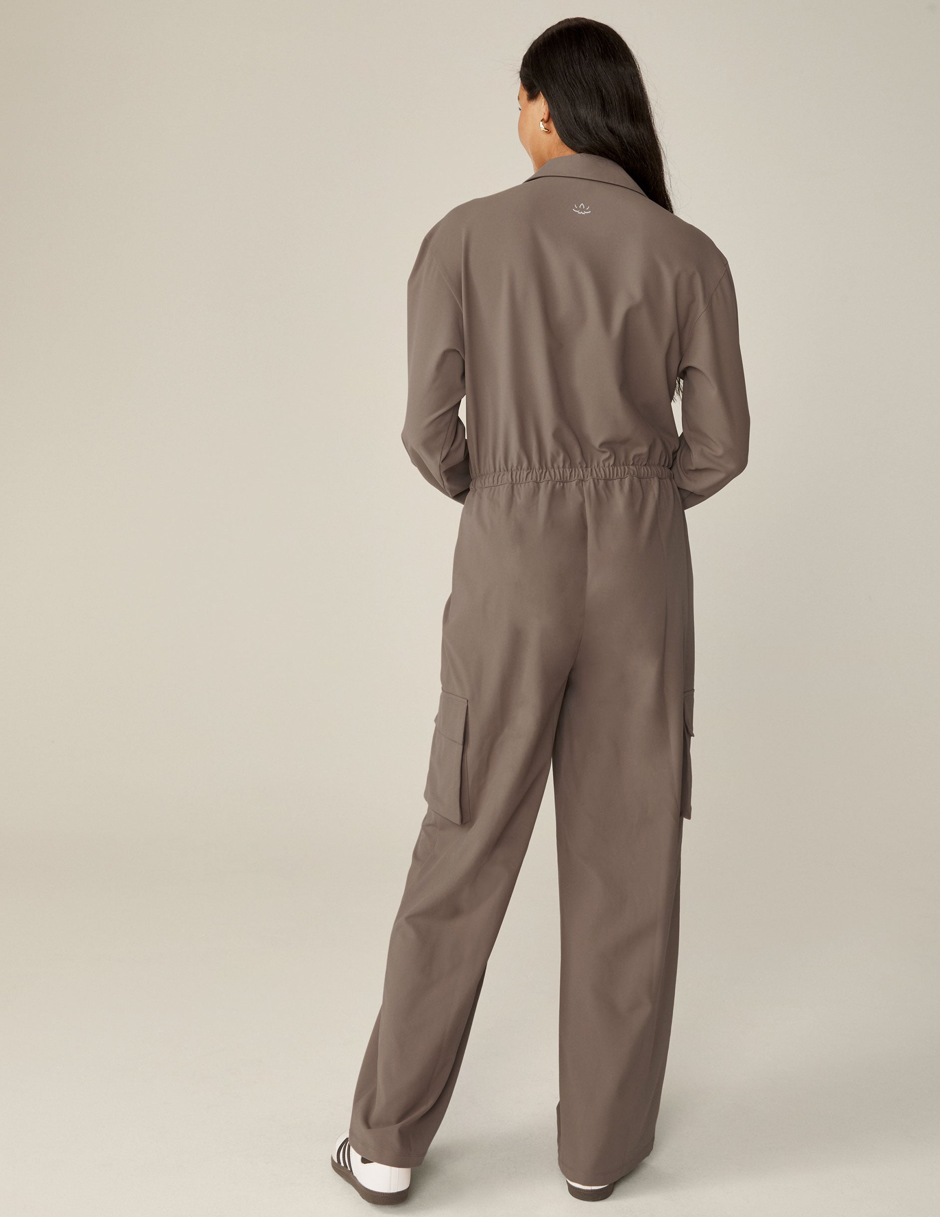 brown long sleeve cargo style jumpsuit with pockets. 