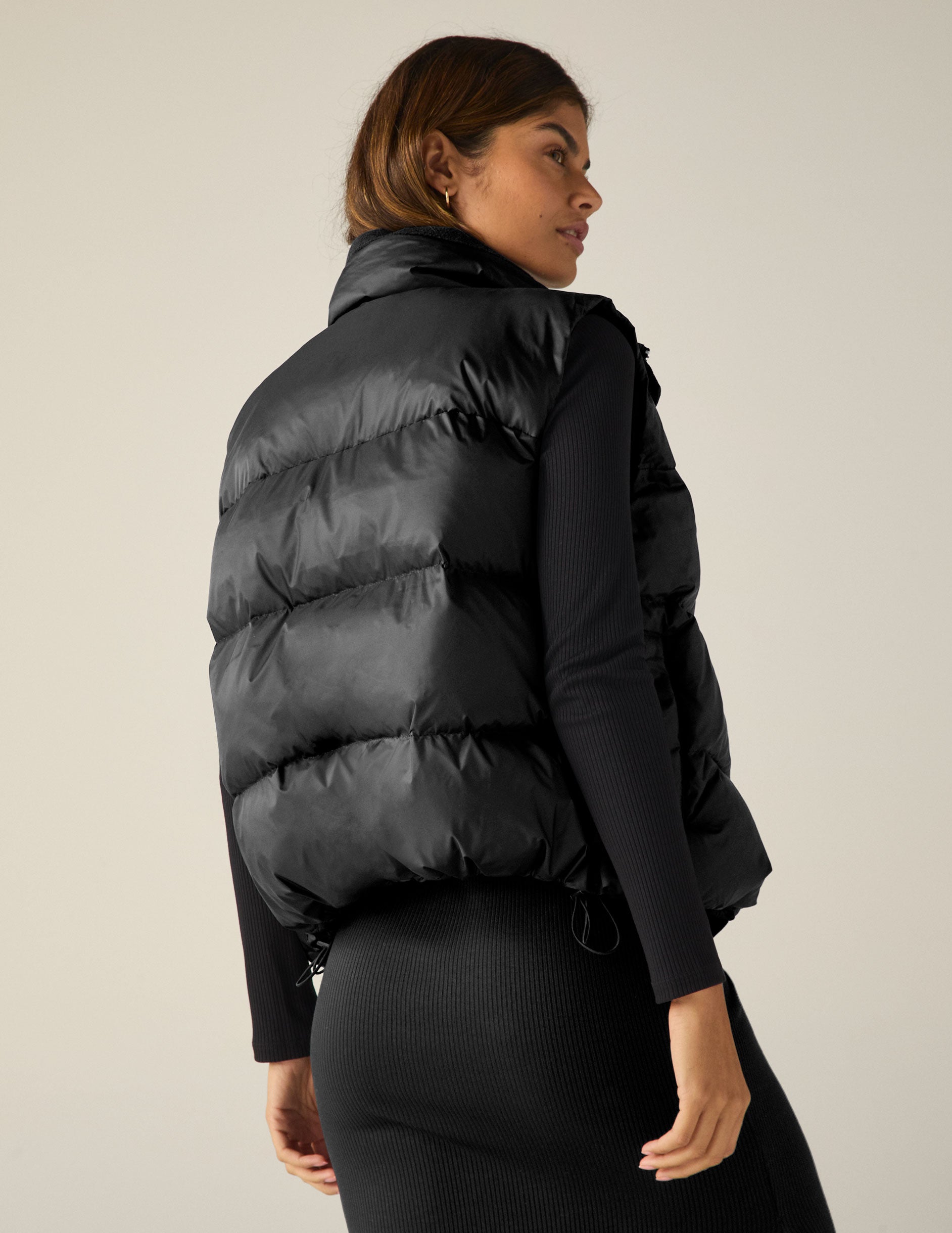 black button up puffer vest. 