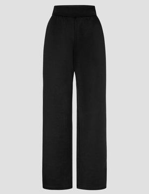 Front view of the black In The Flow Wide Leg Pant with a high-rise elastic waistband and loose, full-length legs.