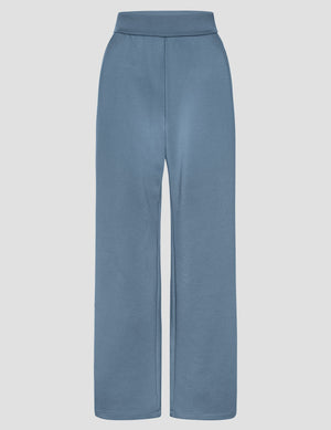 In The Flow Wide Leg Pant in ice blue with a high elastic waistband, slant pockets, and a loose, full-length silhouette.
