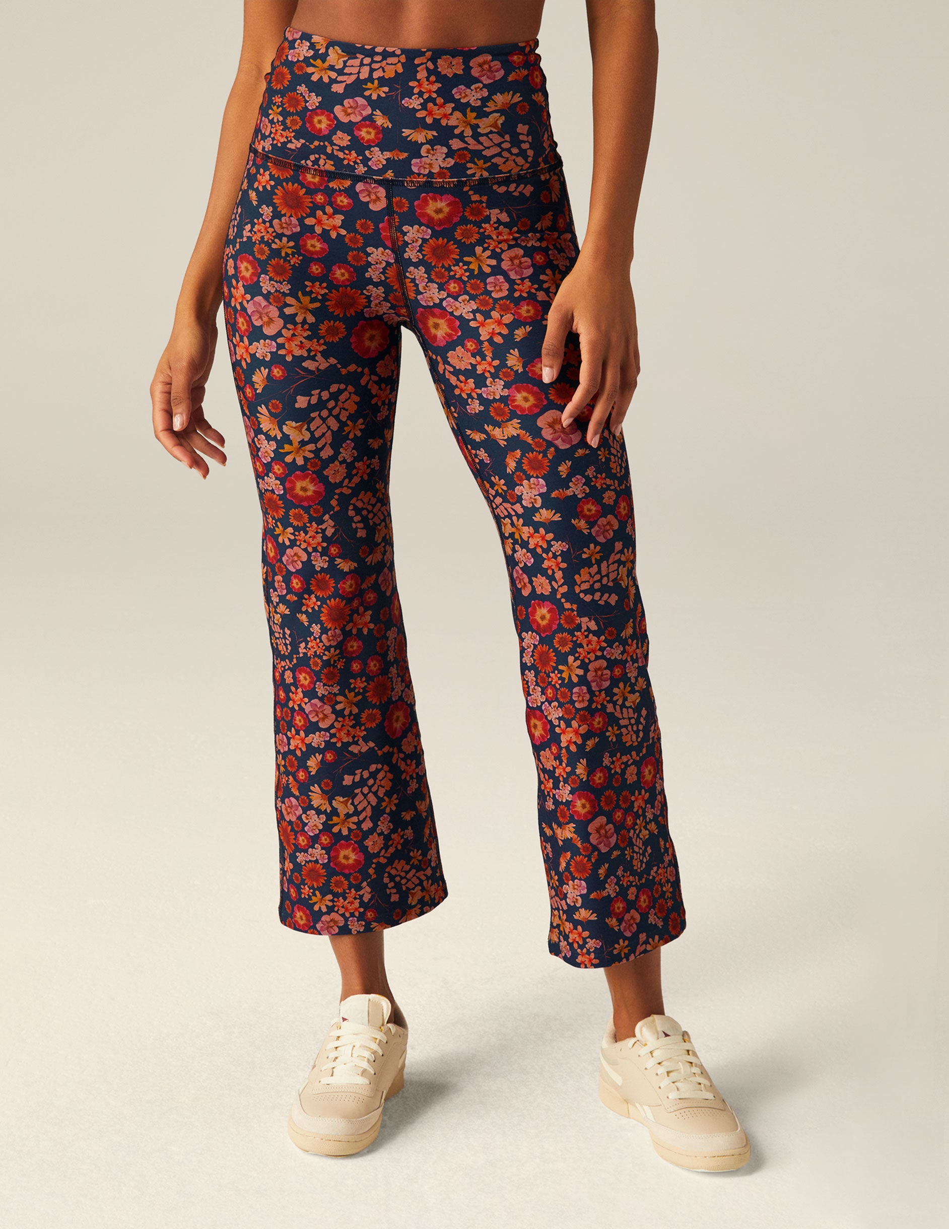blue high-waisted cropped pants with a retro floral design. 