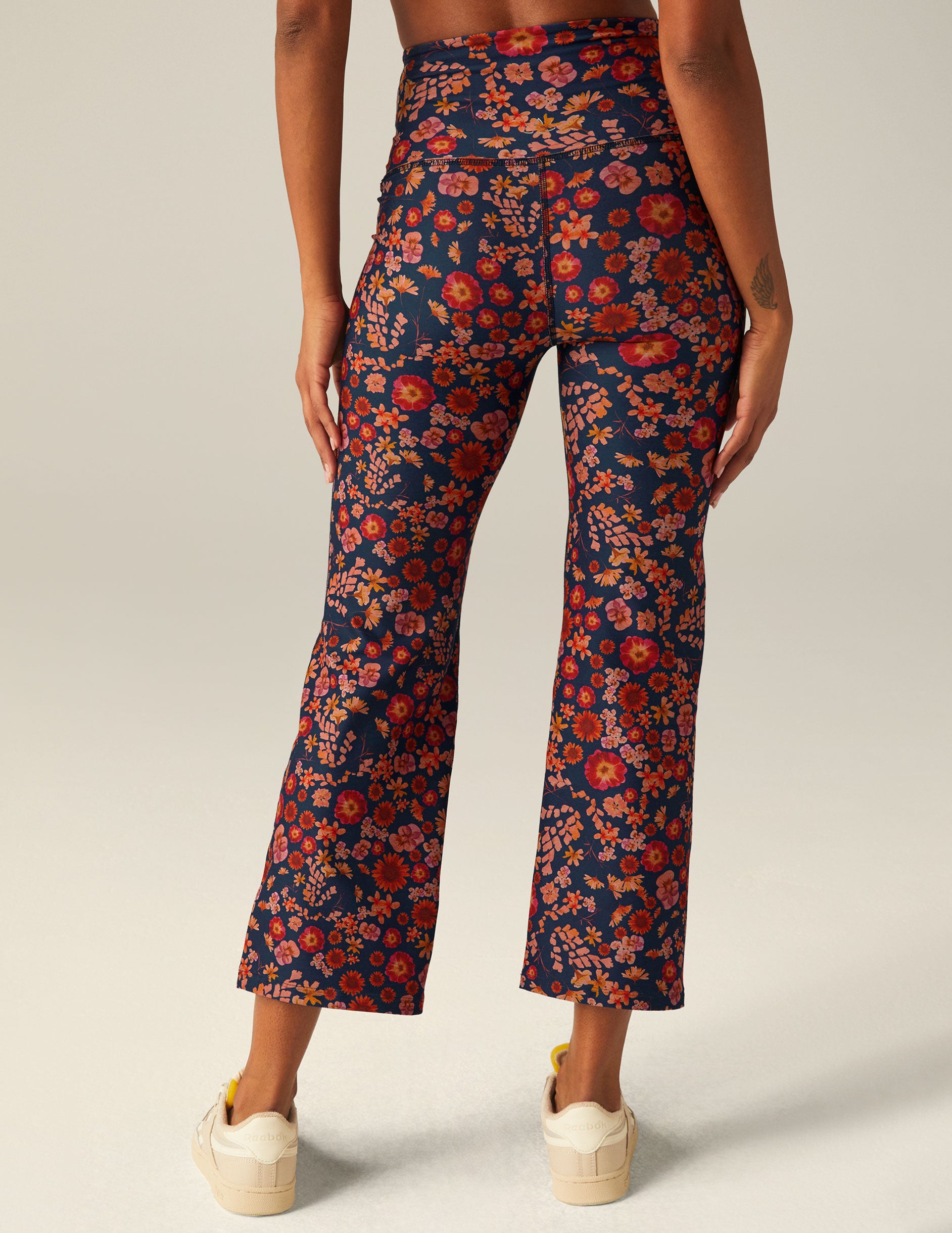 blue high-waisted cropped pants with a retro floral design. 