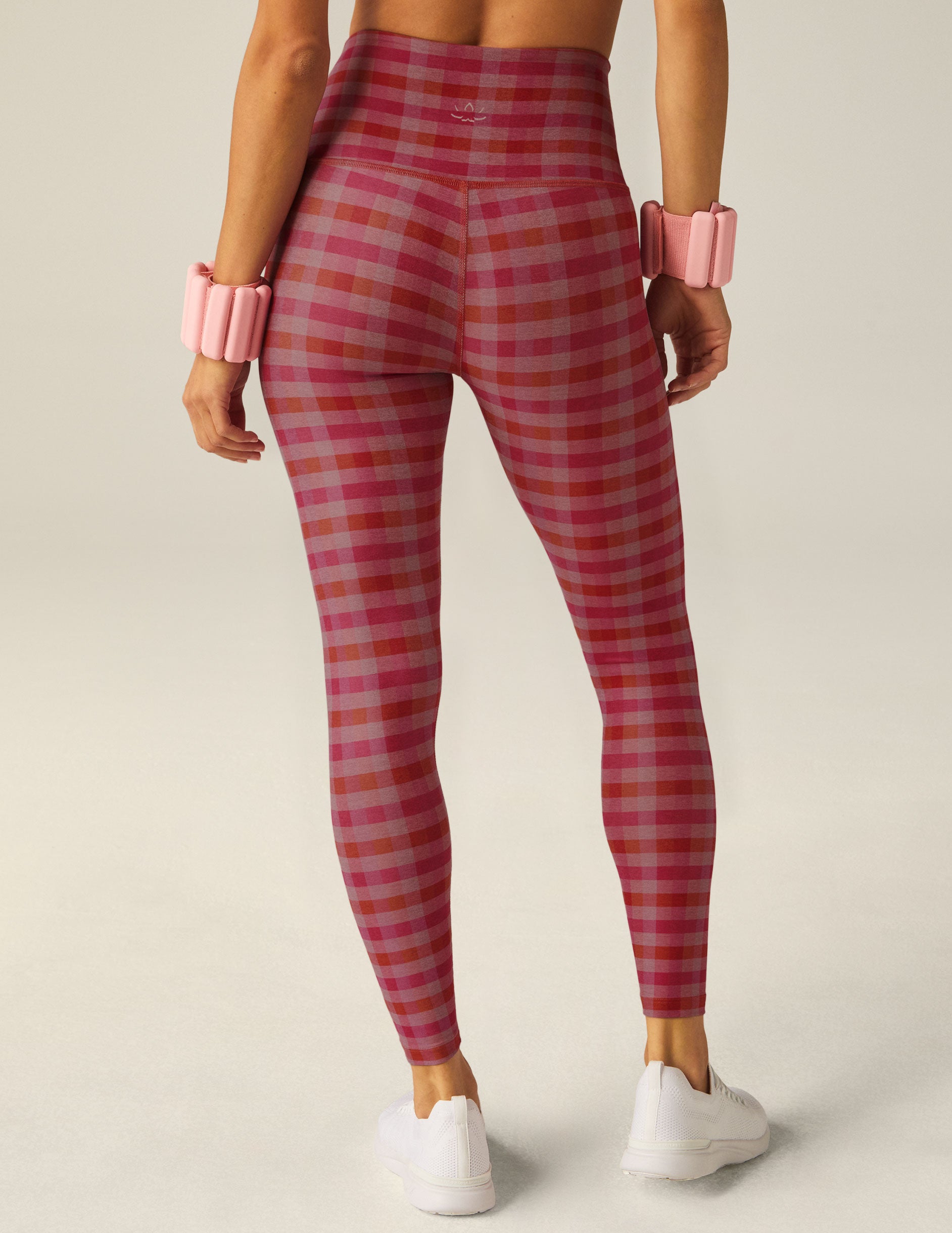 pink, grey, and orange gingham printed high-waisted midi leggings. 