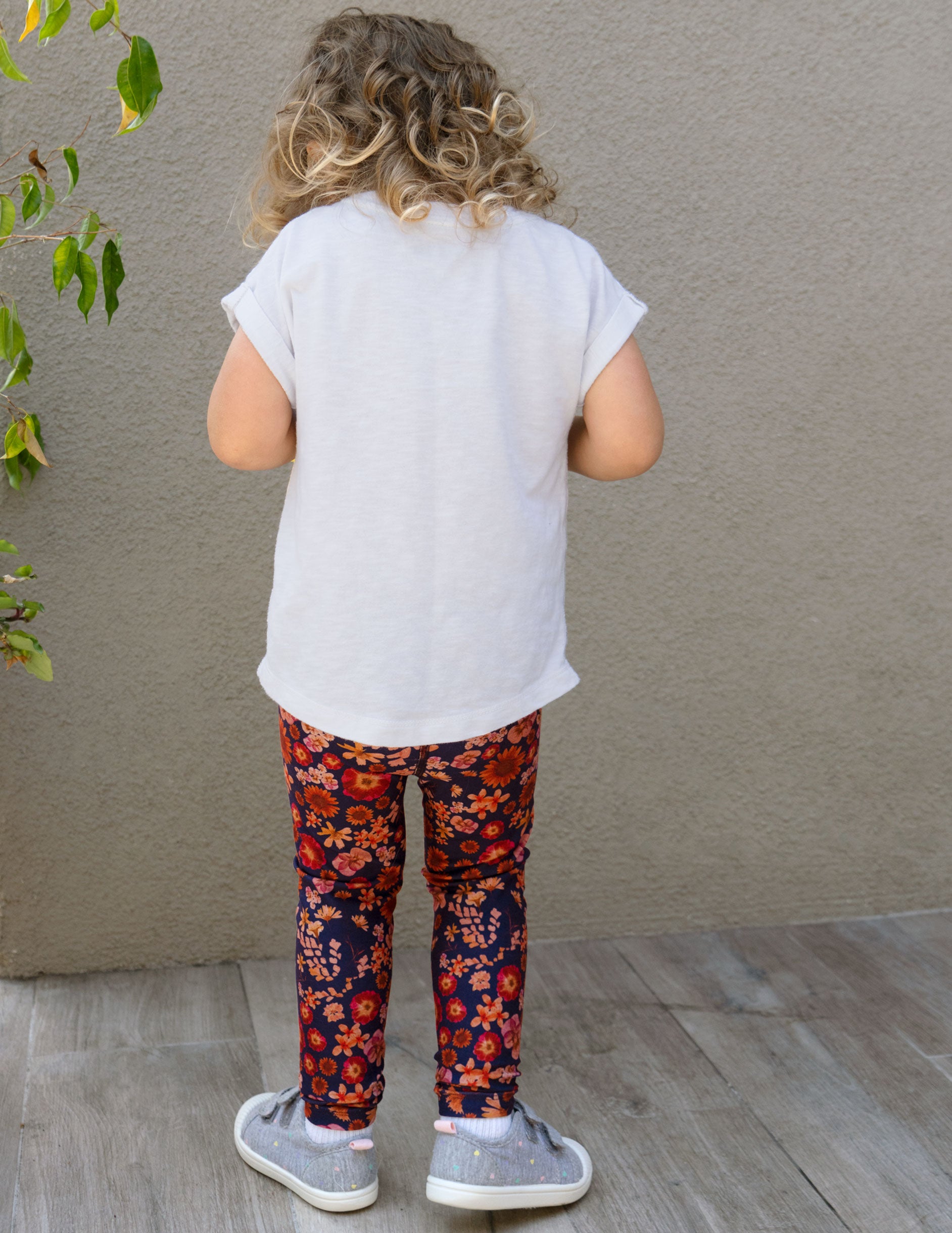 blue toddler leggings with a retro floral print. 
