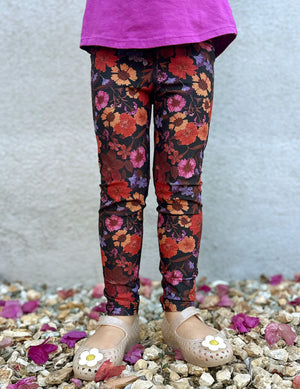 model is wearing toddler floral printed leggings. 