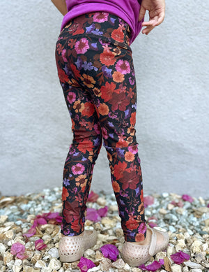 model is wearing toddler floral printed leggings. 