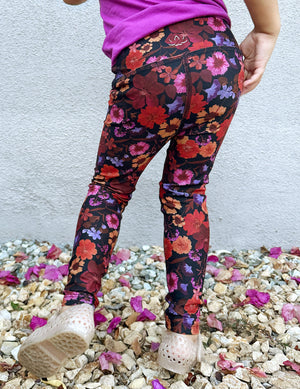model is wearing toddler floral printed leggings. 