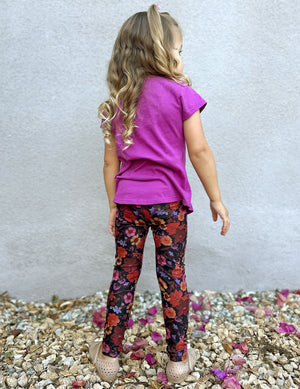model is wearing toddler floral printed leggings. 