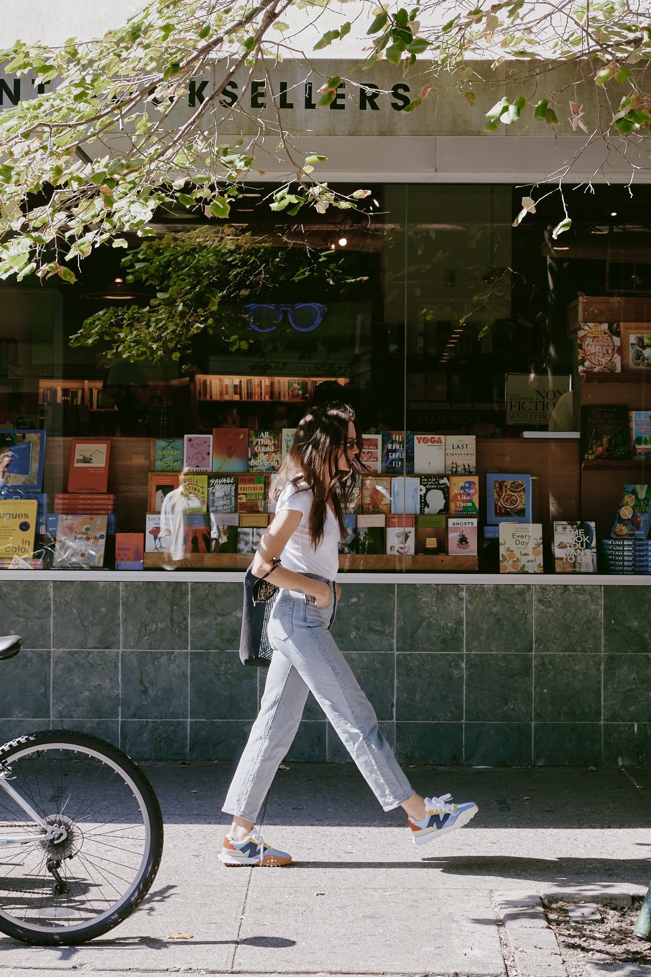 Rachel outside of The Goodsmart in jeans and white tee