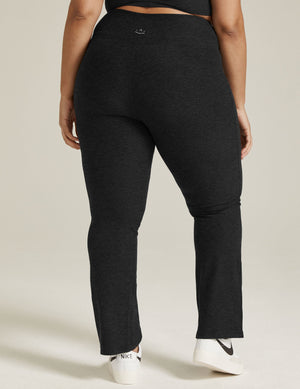 Rear view of the black marled Spacedye Practice High Waisted Pant, featuring a wide waistband and a bootcut silhouette.