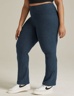 Model wearing navy marled Spacedye Practice High Waisted Pant, featuring a snug fit, high rise, and bootcut leg opening.
