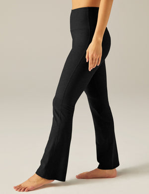 Black marled Spacedye Practice High Waisted Pant with a wide waistband and flared bootcut leg, shown from a side profile.