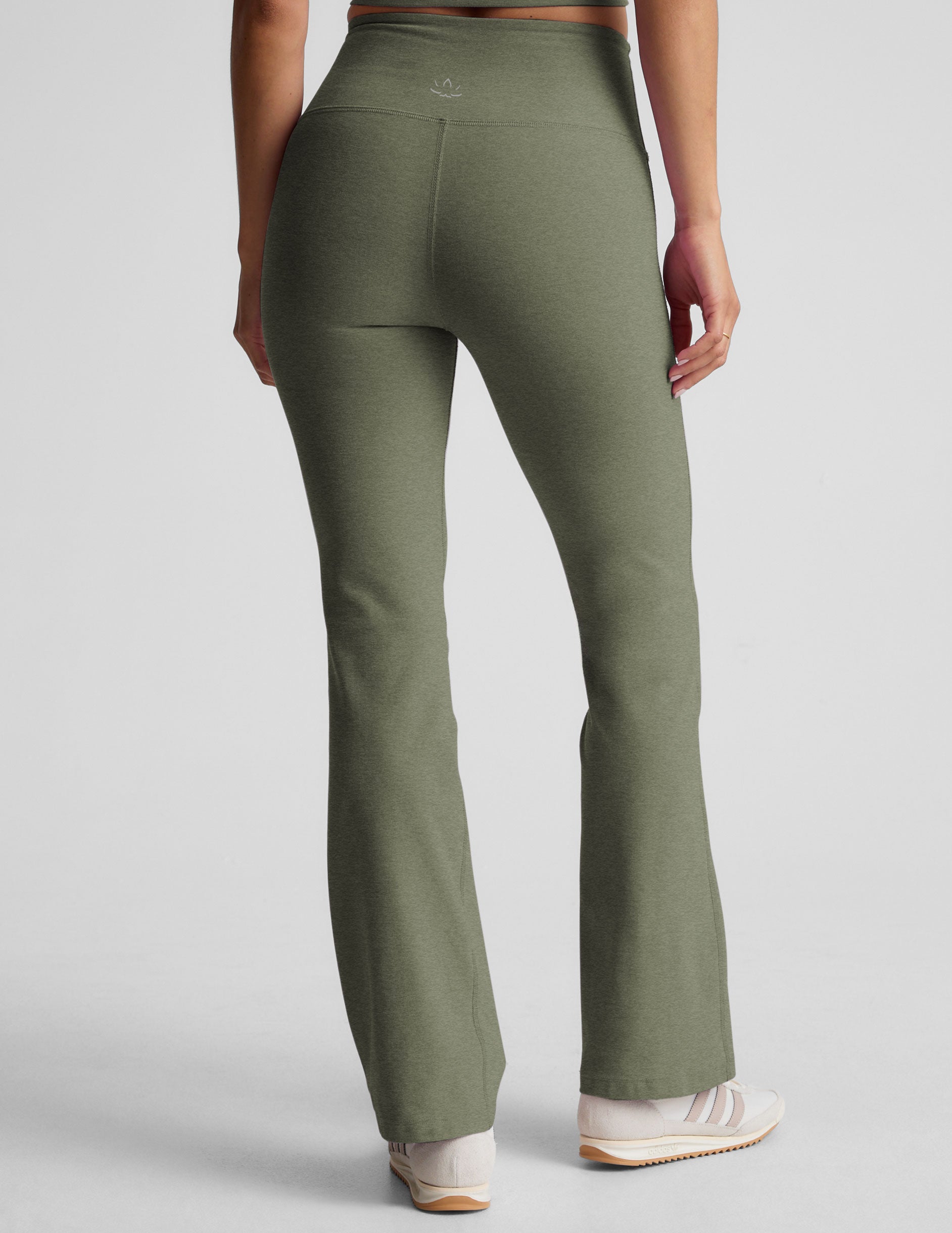 green high-waisted bootcut pants. 