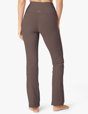Rear view of the dark gray Spacedye Practice High Waisted Pant, showing the high waistband and bootcut leg silhouette.