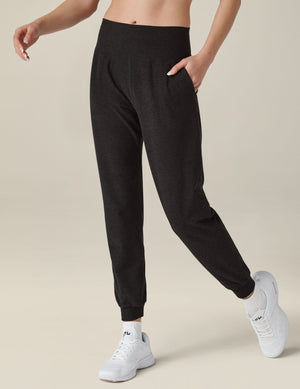 Spacedye Midi Jogger in black marled fabric featuring a wide waistband, side pockets, and tapered legs with banded cuffs.